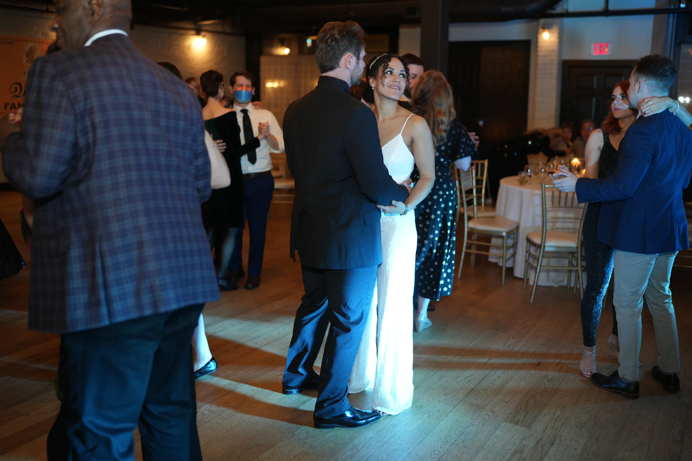 Bride and groom dancing with their guests during a wedding reception at Brown’s Revolution Hall in Troy, New York